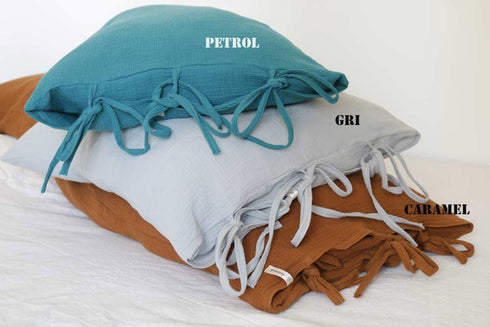 Față de perna din muselină